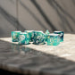 MET634 Teal and Black Eternal Resin Dice with White Numbers 16mm (5/8in) 7 Dice Set